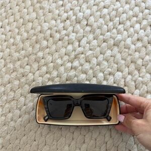 RAEN Black Sunglasses with Gold Accents